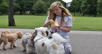 Hannah giving treats to her dog